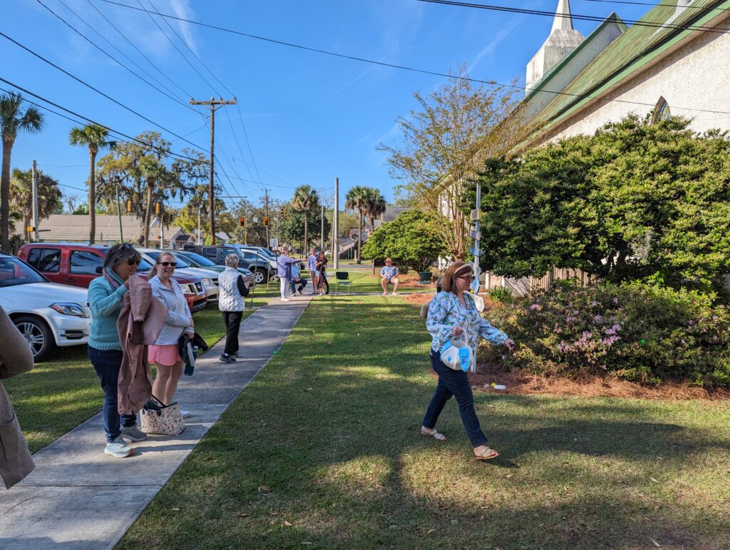 Asbury Memorial Church community members gathered outdoors beside the church