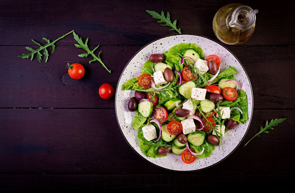 Fresh salad with tomato, cucumber and olives